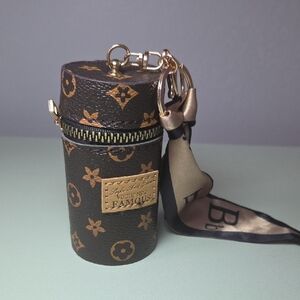 Monogram Cylinder Key Holder with Gold and Black